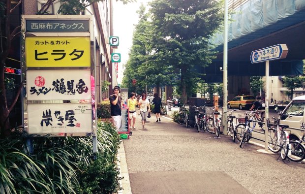 The restaurant is right behind its sign (on the left side)